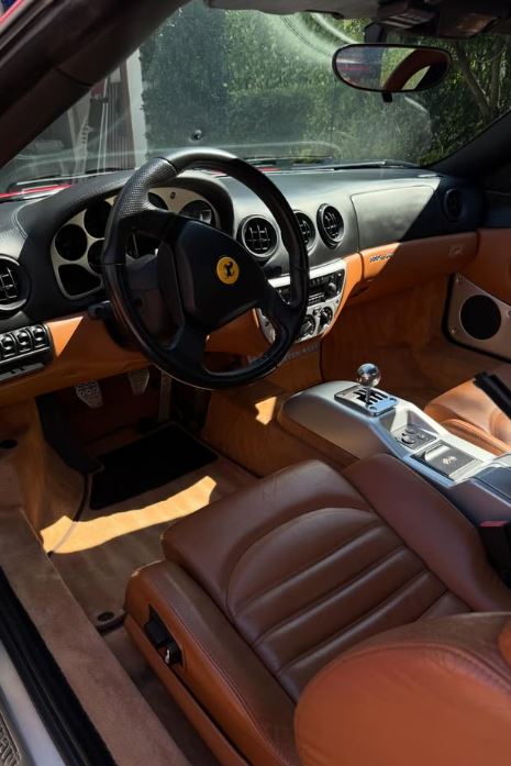 Deep interior extraction and detailing tools inside an SUV cabin